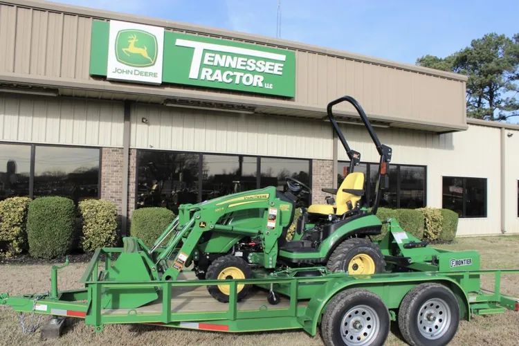 John Deere 1025R, 120R Front End Loader, 60D Drive Over Deck, Frontier BB5060 5ft Box Blade, & 18ft O'Neal trailer.