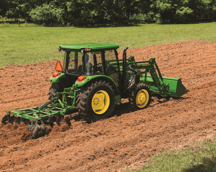 A John Deere 5075E tractor plows a field in Tennessee.