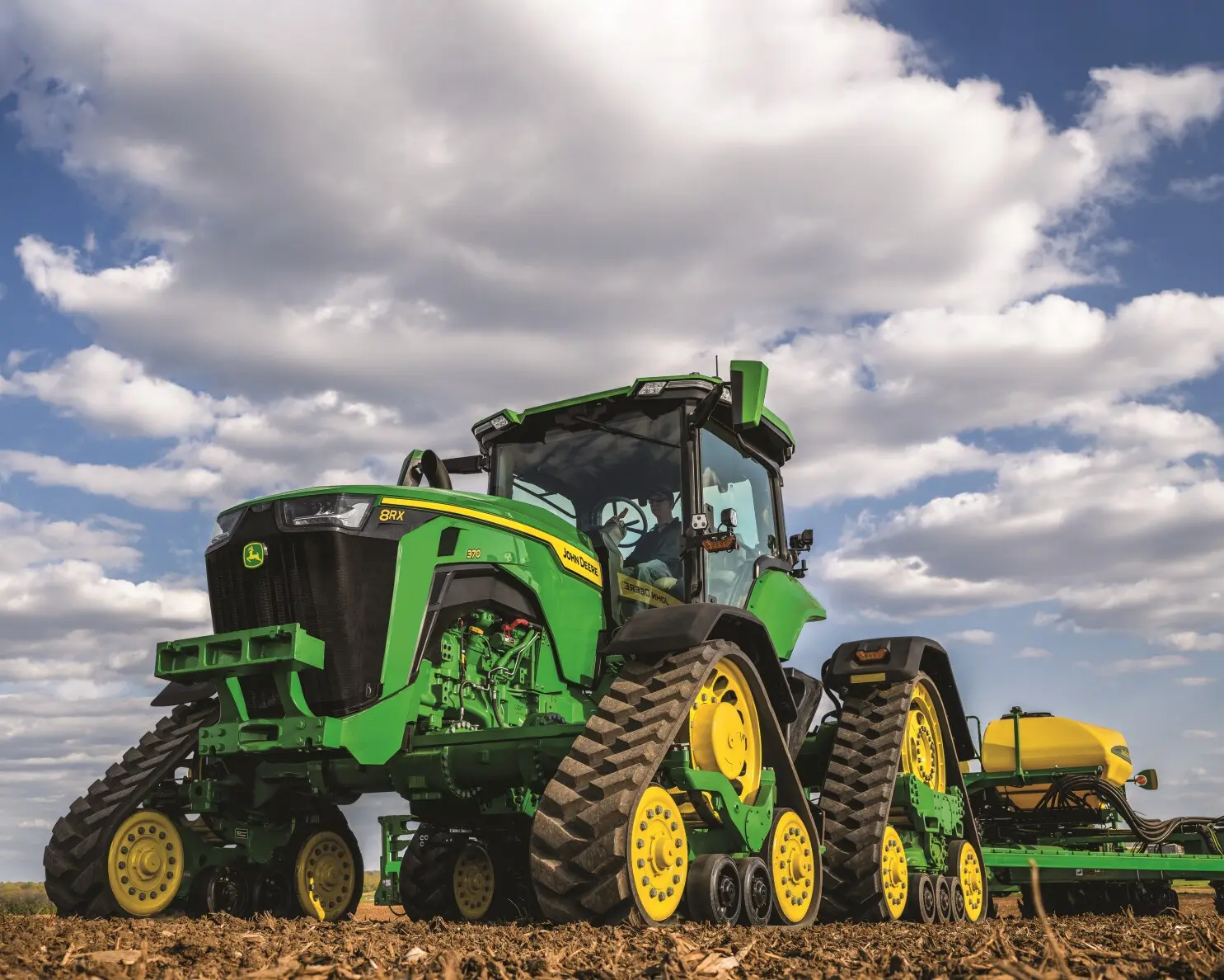 John Deere 8RX Tractor in a field.